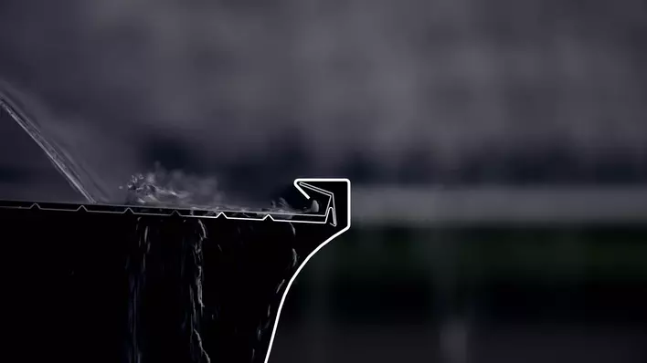 Close-up of a low-maintenance rain gutter on a roof 