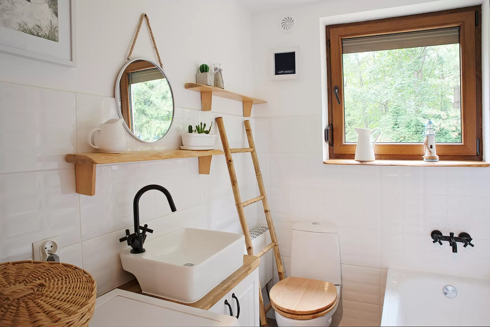 Interior of a modern bathroom with a casement window.