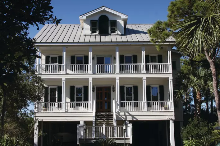 New metal roofing installed on a large beach house in Port City.