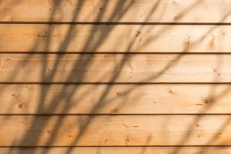 An up-close view of wood siding on a home.