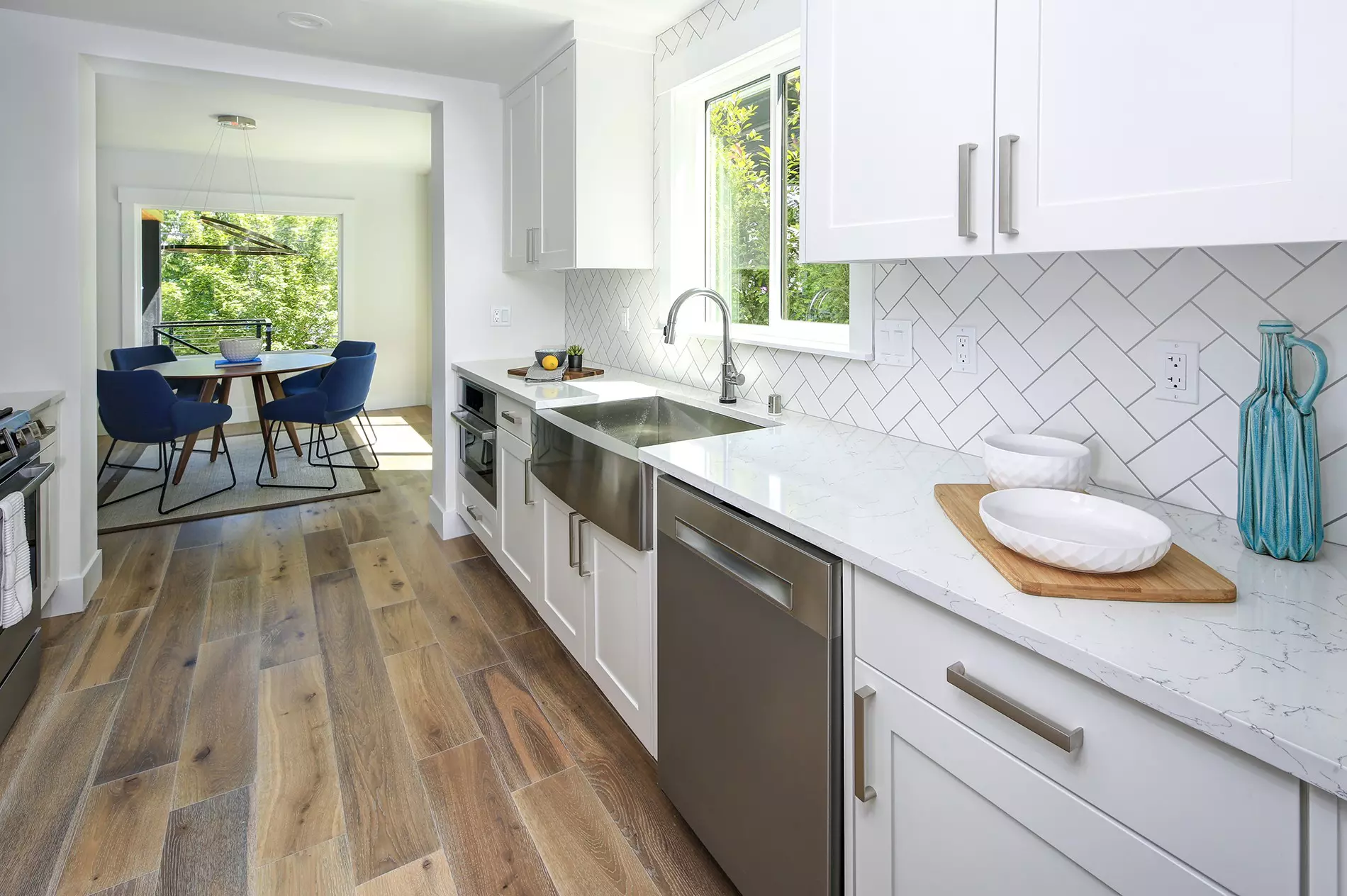 A spacious feeling small kitchen with natural light from a window