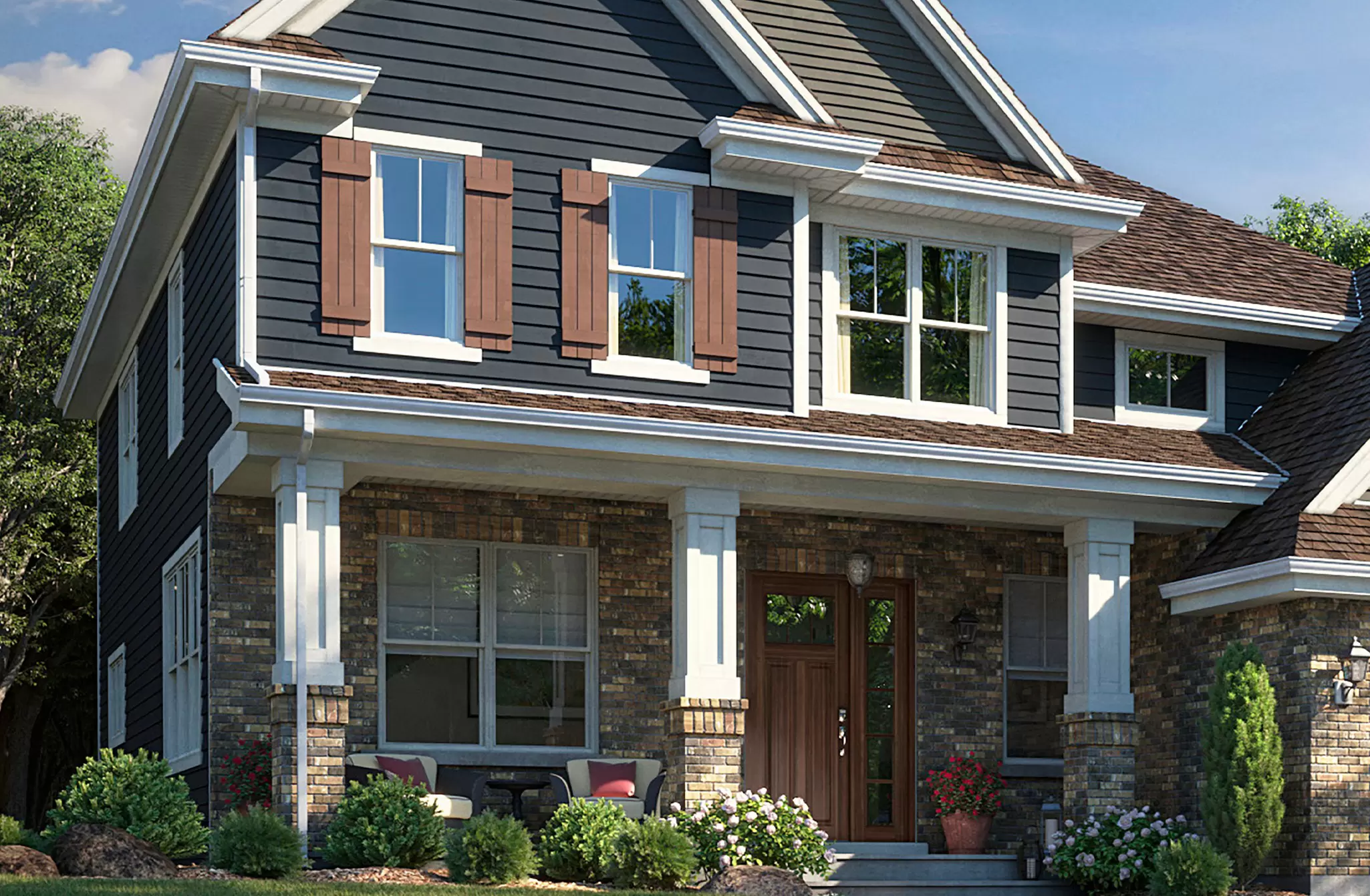 Two-story home with dark blue siding and a woodgrain front entry door.