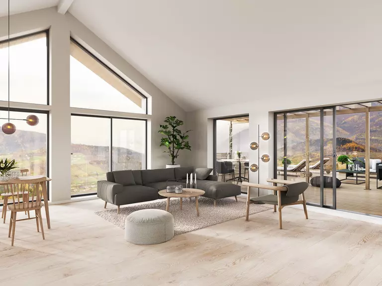 Open concept living room with wood flooring and geometric specialty windows.