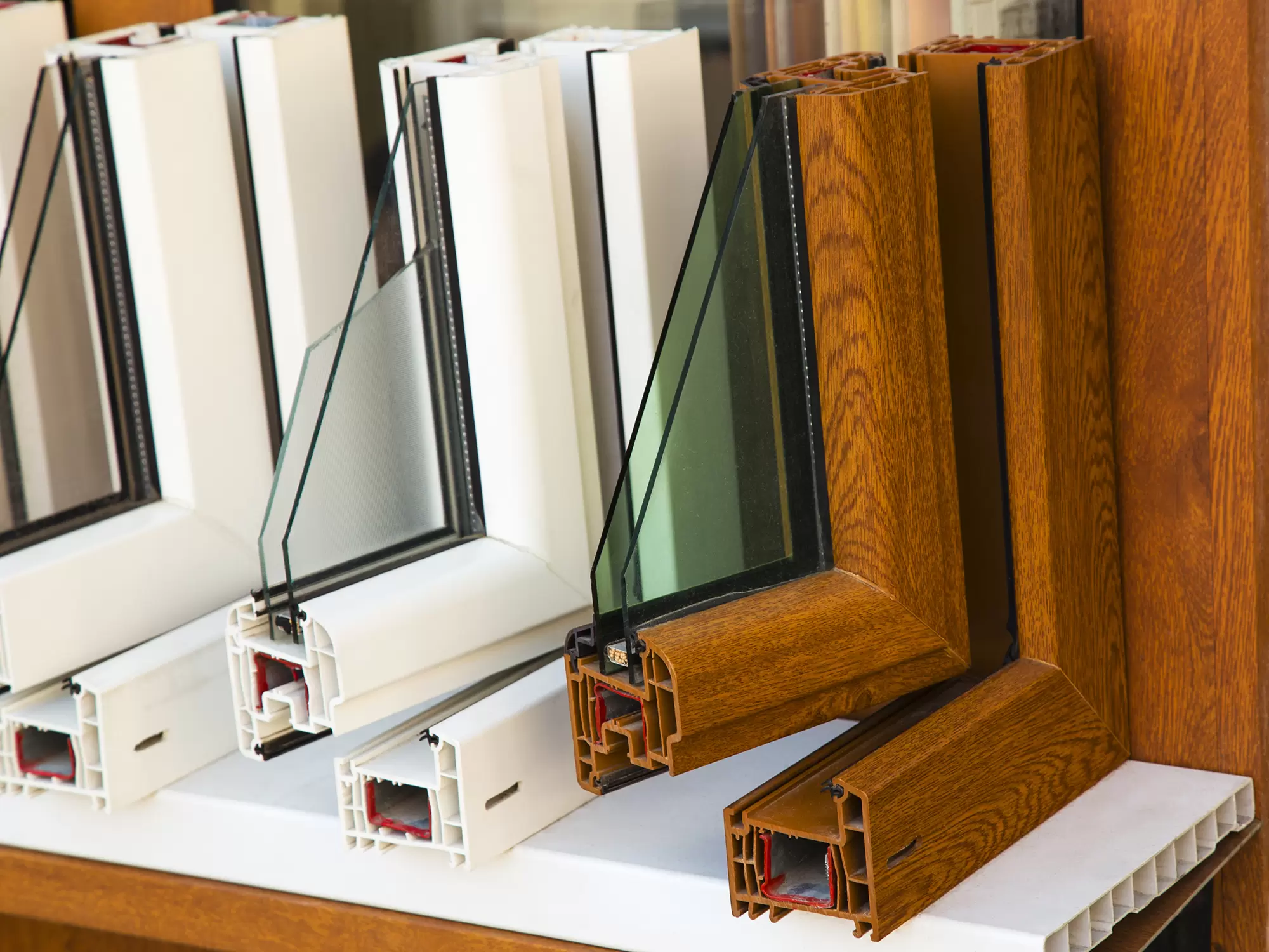 Vinyl window frame samples with double-pane glass.