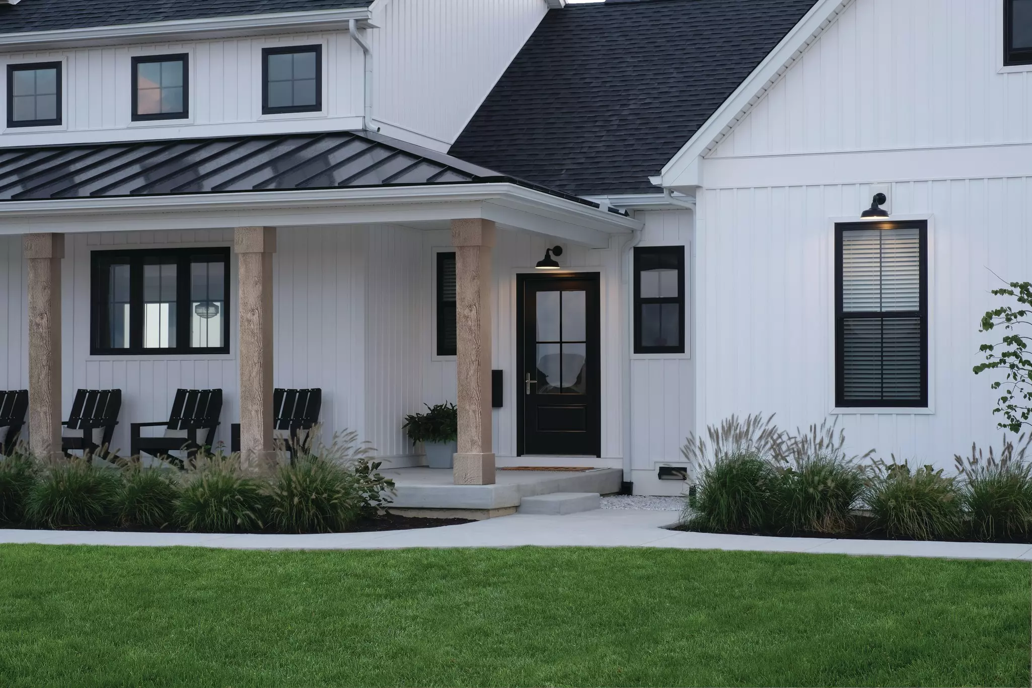 Front of a home with white siding.