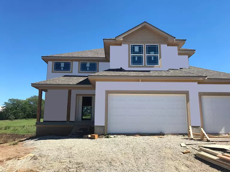 Home being framed in preparation for vinyl siding installation project.