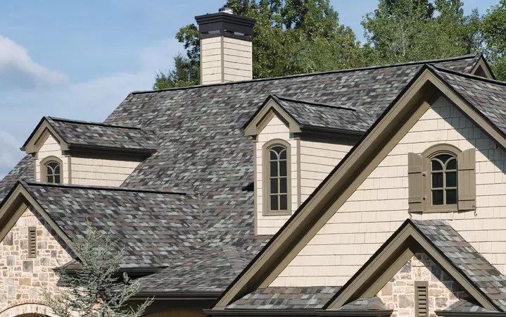 Close-up of a 2 story home with Owens Corning's TruDefinition Duration Designer shingle line in the color Storm Cloud