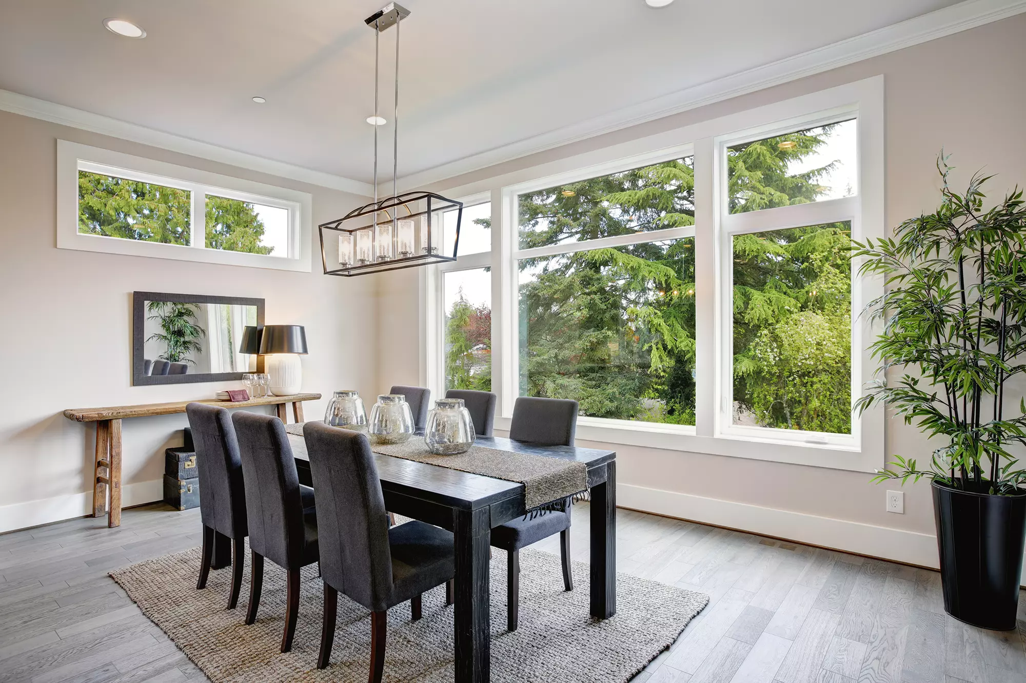 Dining room with a view of trees outside.