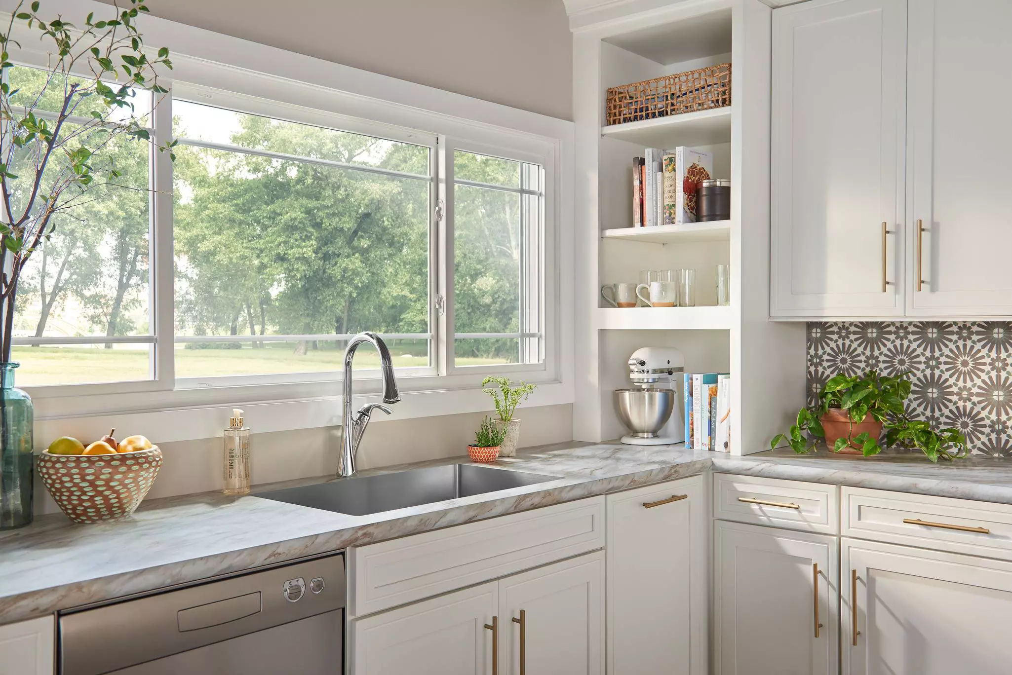 Sliding window above kitchen sink offering clean profile ventilation.