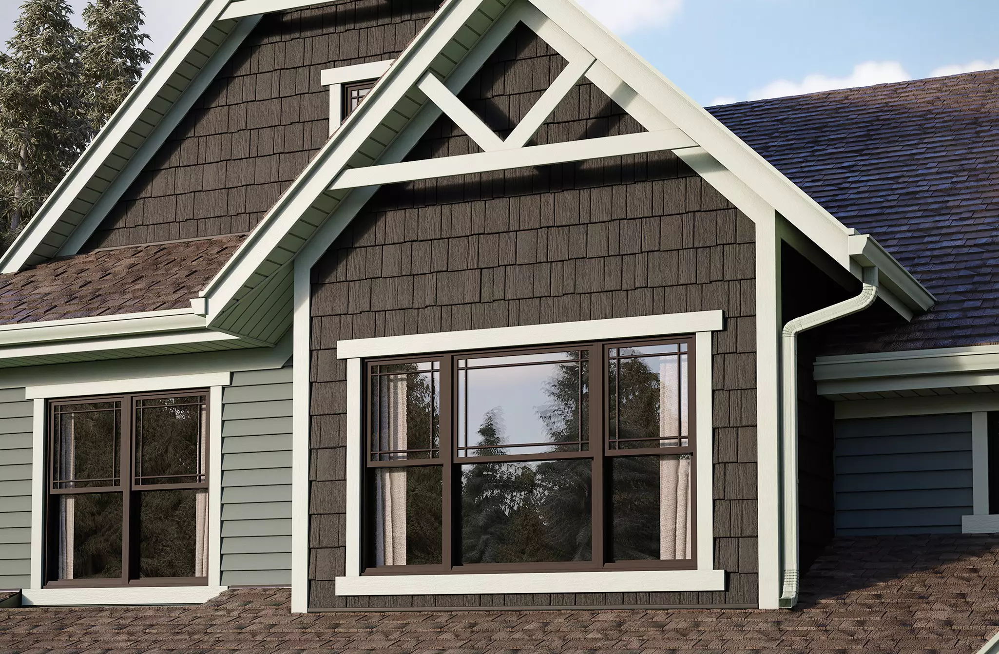Fiber cement shingle and lap siding on a craftsman-style home in sage green and brown.