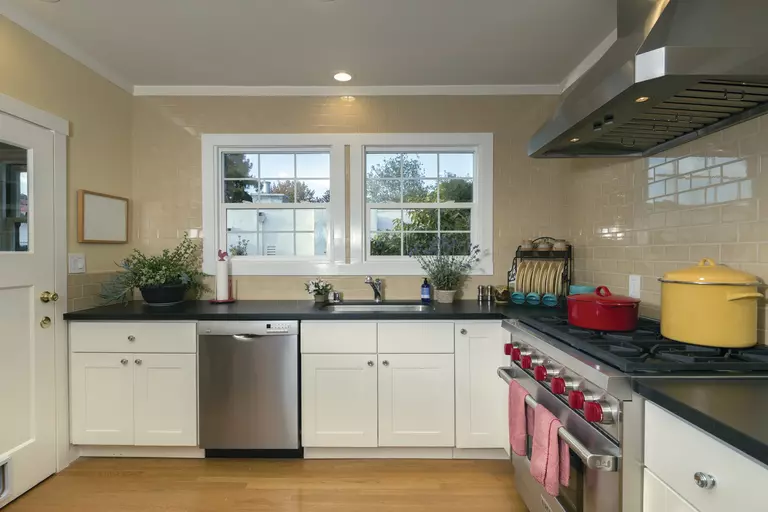 Home kitchen with a pair of square double-hung windows.