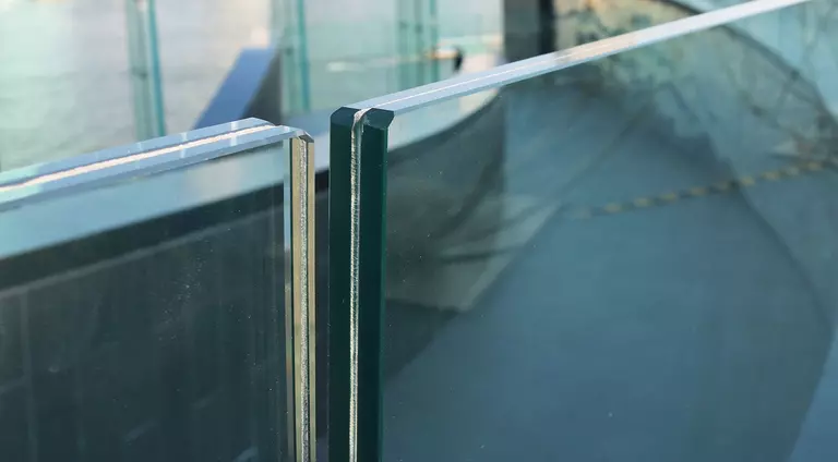 Close-up of sheets of laminated glass railing.