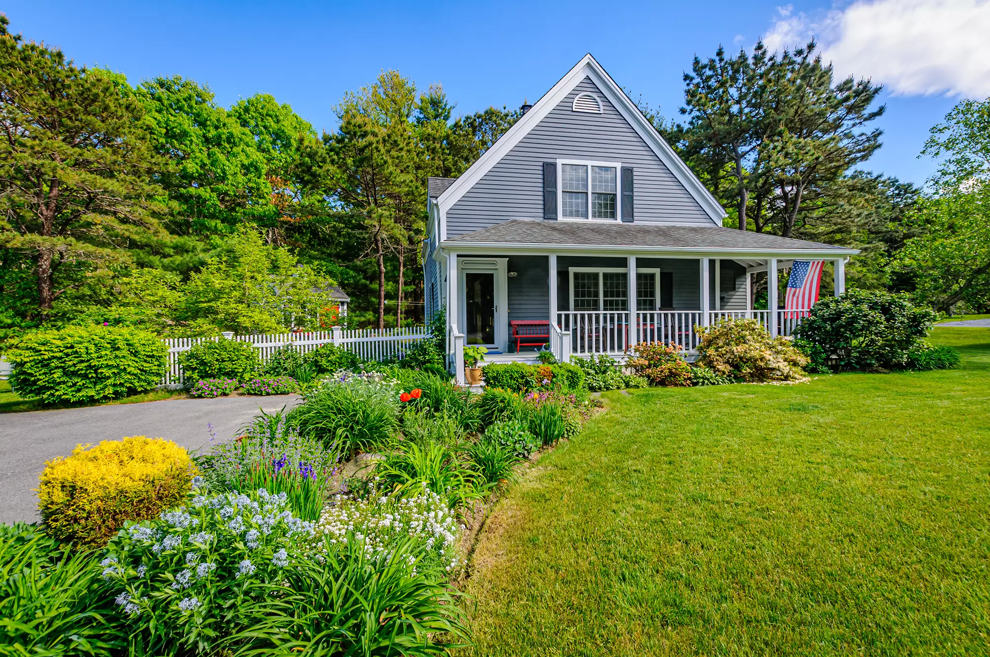 Landscaping in front of a home's porch.