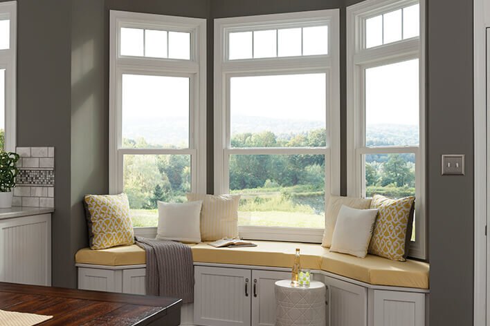 A comfortable bench surrounded by windows