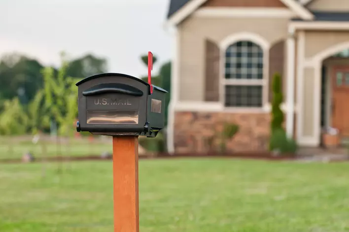 An older mailbox in need of replacement to increase curb appeal and match the home’s facelift.