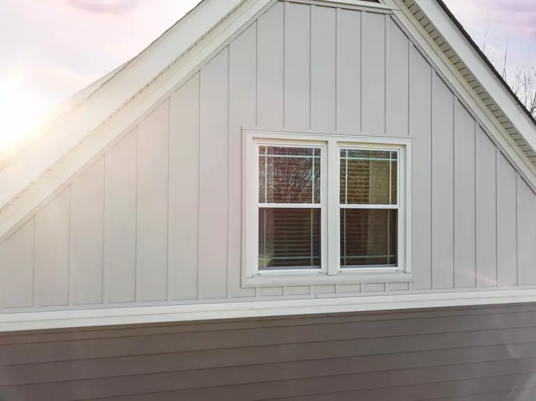 New vinyl siding that has just been installed onto a multi-level home.