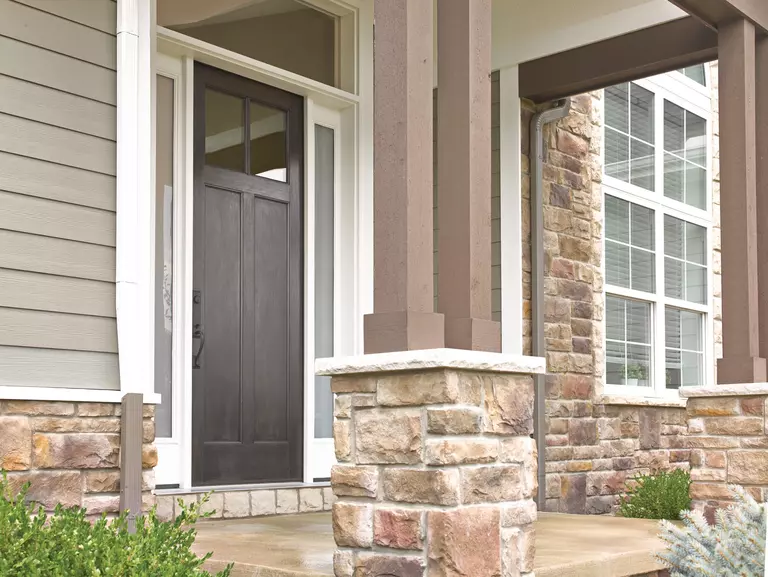 Exterior door of a home with a woodgrain texture.