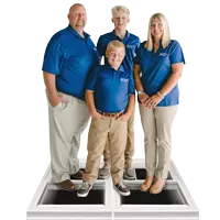 Window World of East Kentucky Owners standing on window