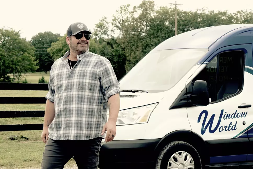 Country music star Lee Brice in front of Window World van