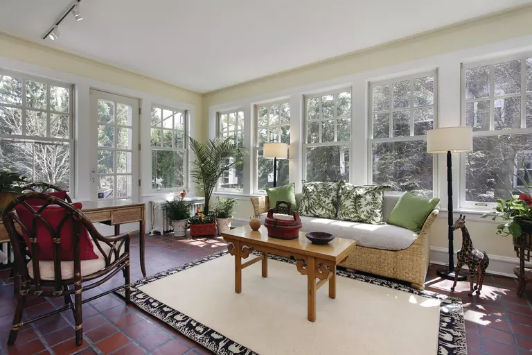 Decorated living room with energy-efficient windows all around.