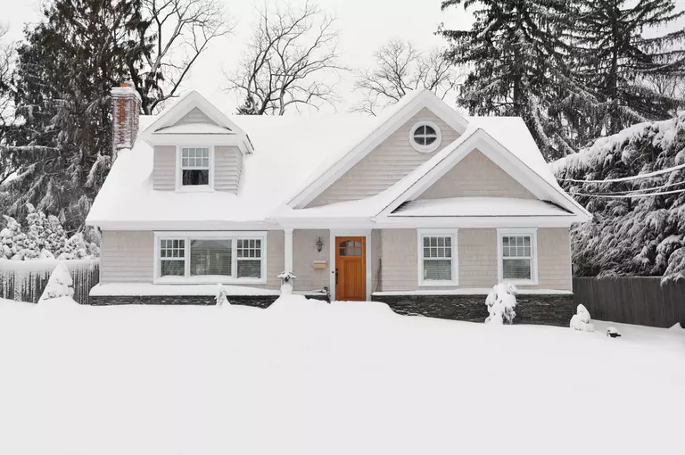 A home that is covered by snow.