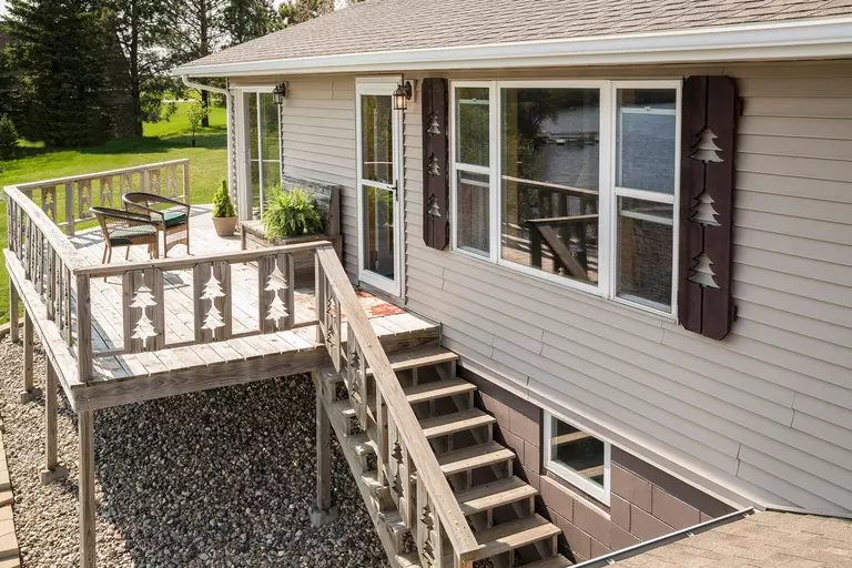 Exterior and deck of a house with quality gutters.