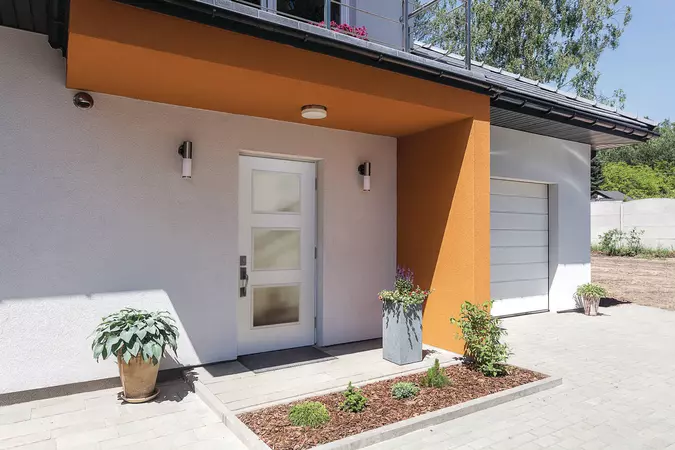 White smooth entry door with 3 large square lites on a modern home