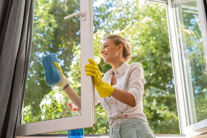 Woman Cleaning Window