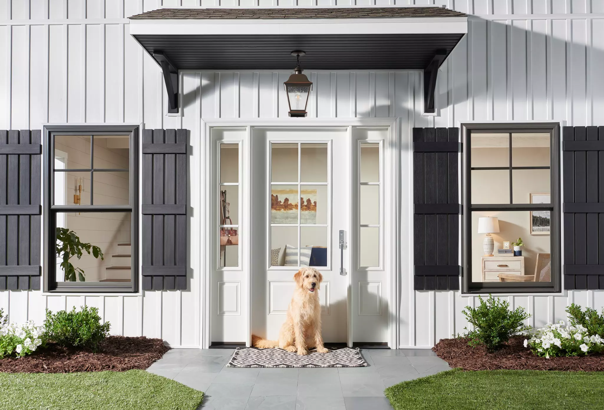 ENERGY STAR certified glass-panel front door on a white board-and-batten home.
