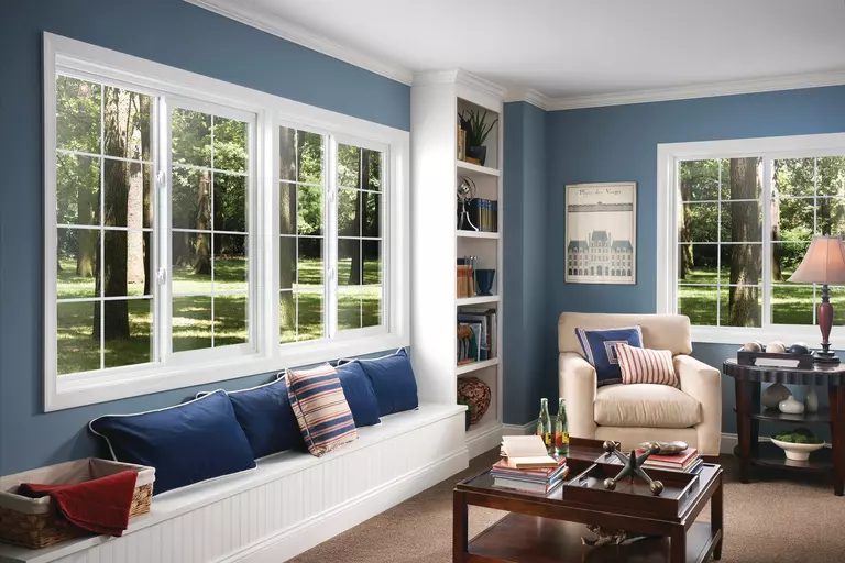 Living room featuring multiple sliding windows with grids.