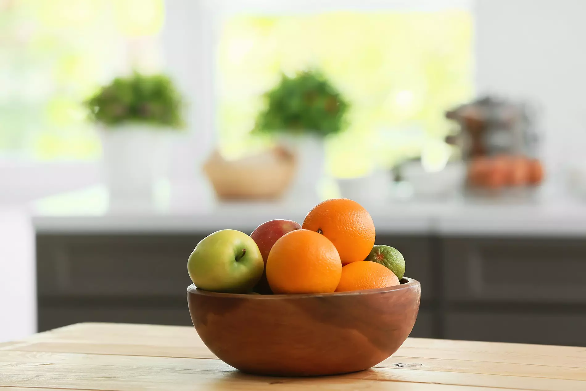Bowl of fruit on a small kitchen countertop