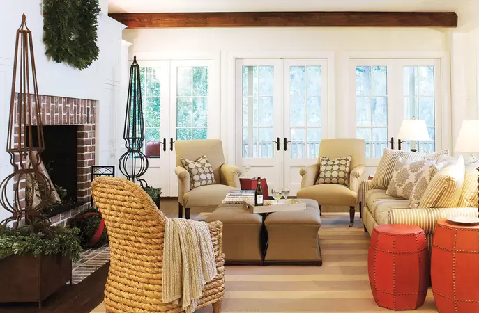 White hinged wood-clad patio doors in a cozy living room with Spanish moss outside in the distance