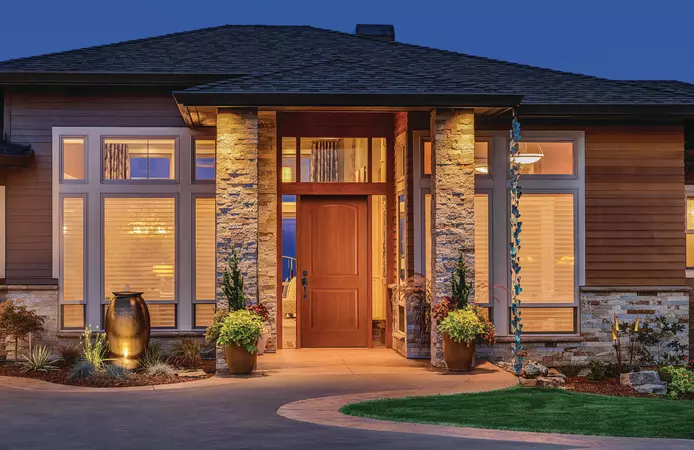 Woodgrain shaker style entry door on a contemporary home