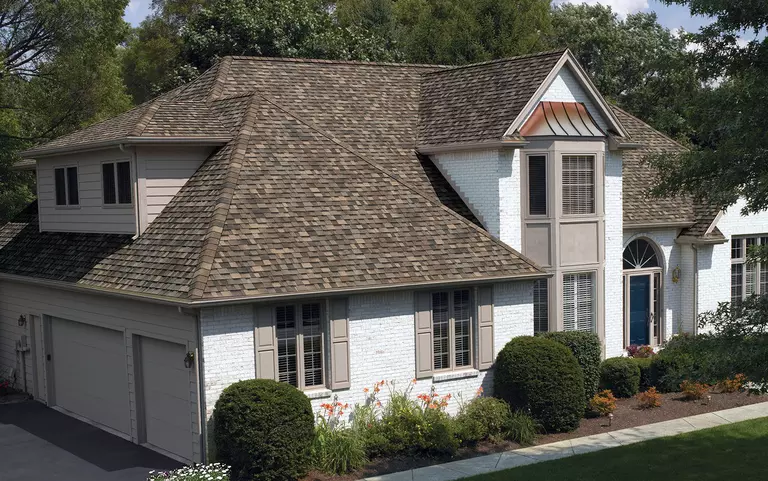 Home with light-gray windows and shutters.