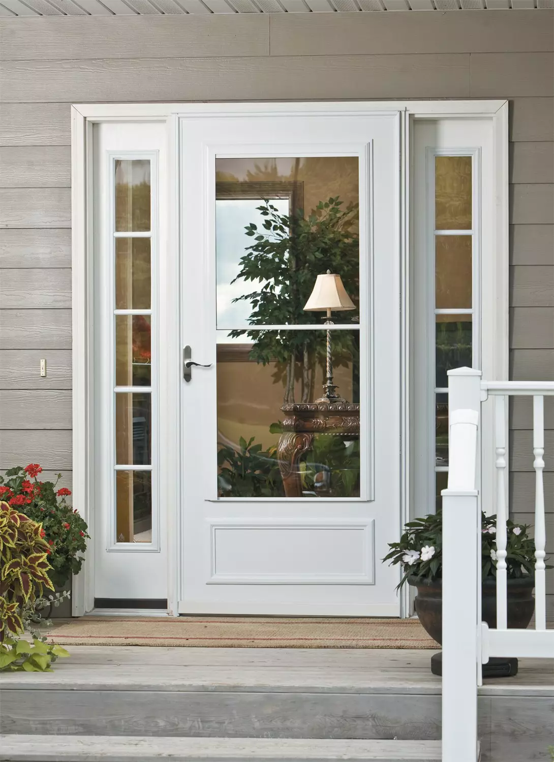 A retractable screen storm door