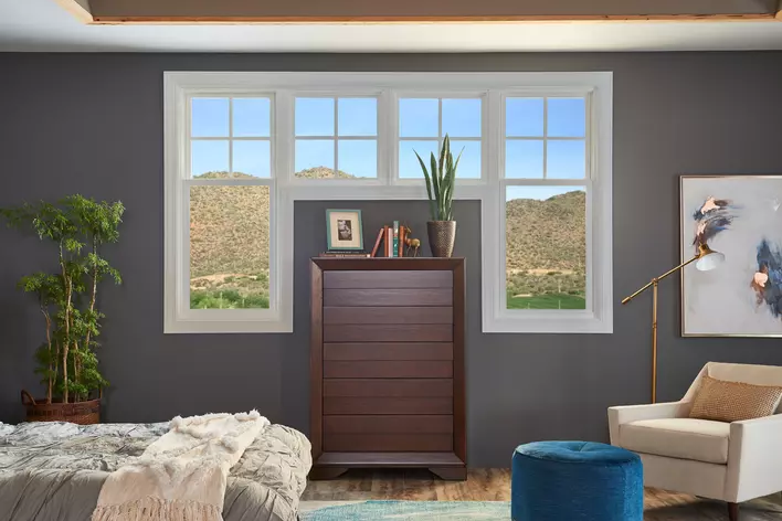 A new window, installed in a master bedroom, brings in a lot of natural light, making the room feel more open.
