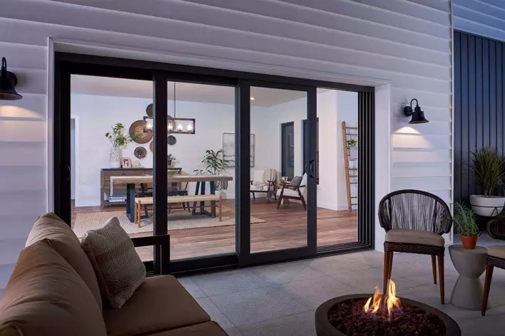 A multi-panel sliding patio door and outdoor patio