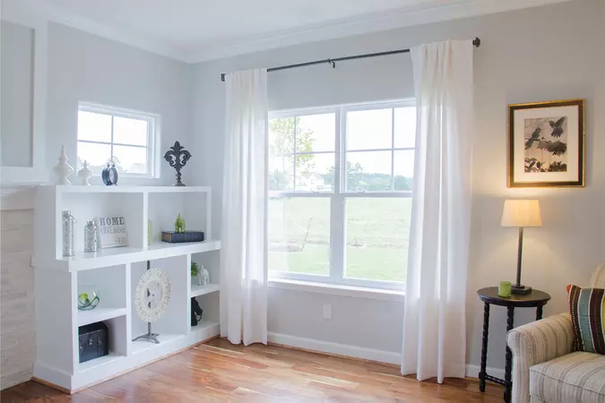 White new construction windows in the corner of a living room 