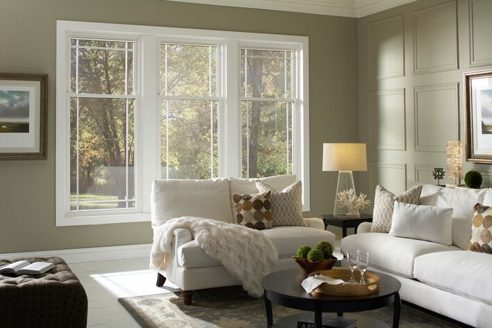 A beautiful living room with custom windows.