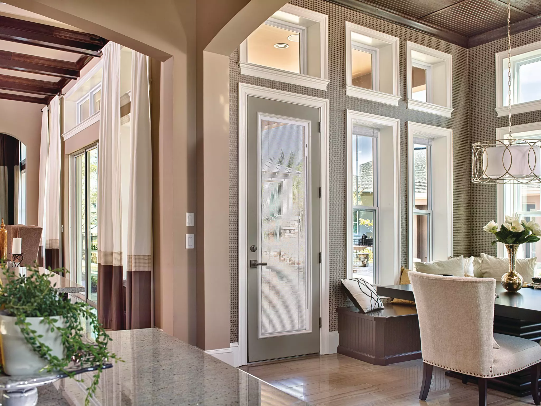 Entry door with blinds in a living area.