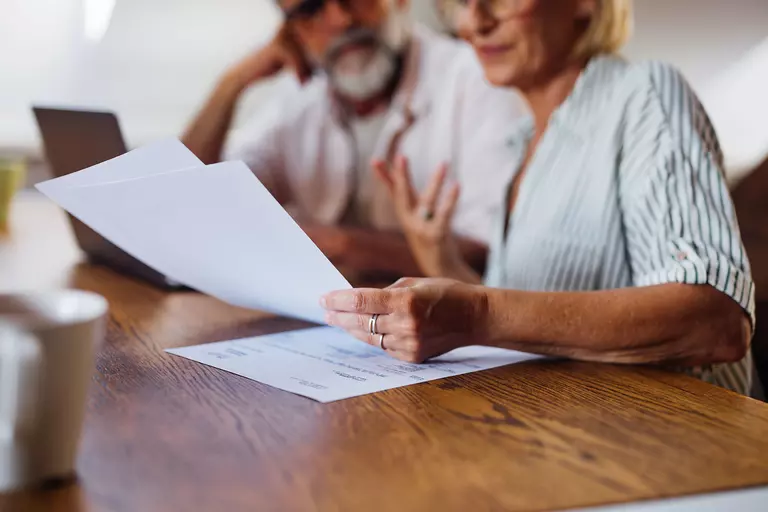 Couple reviewing documents together.