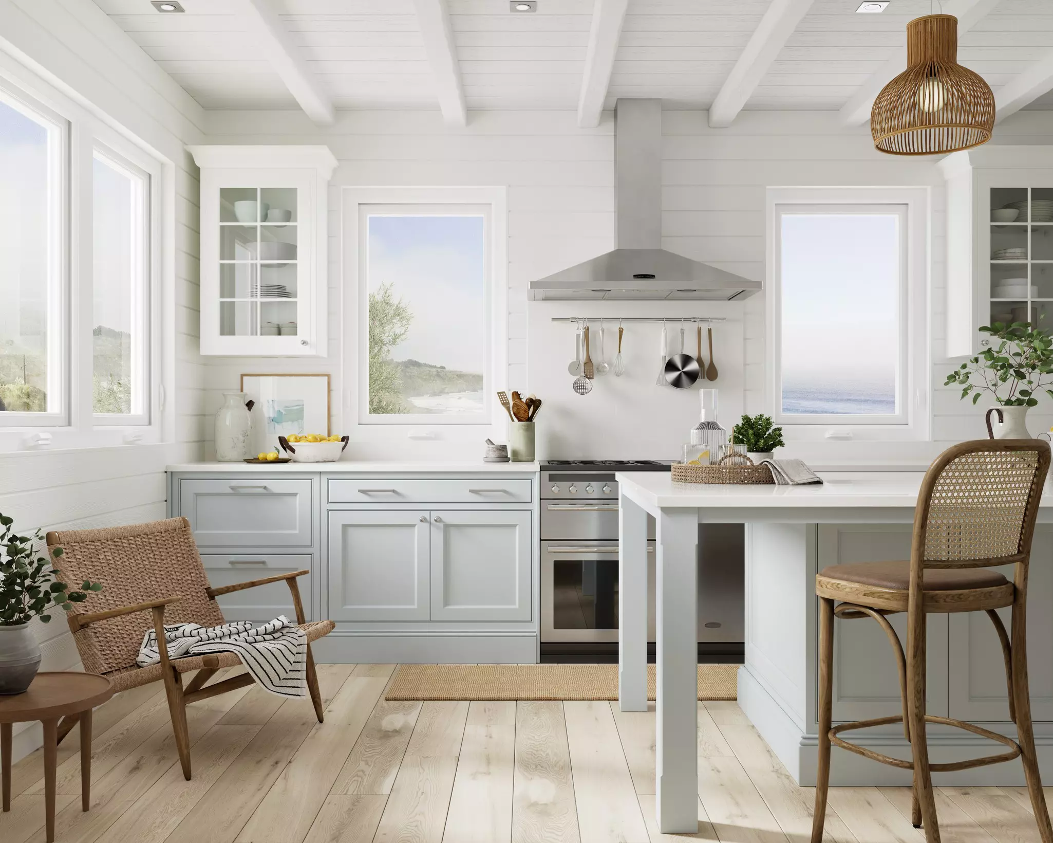 A bright kitchen with impact windows set into white shiplap walls.