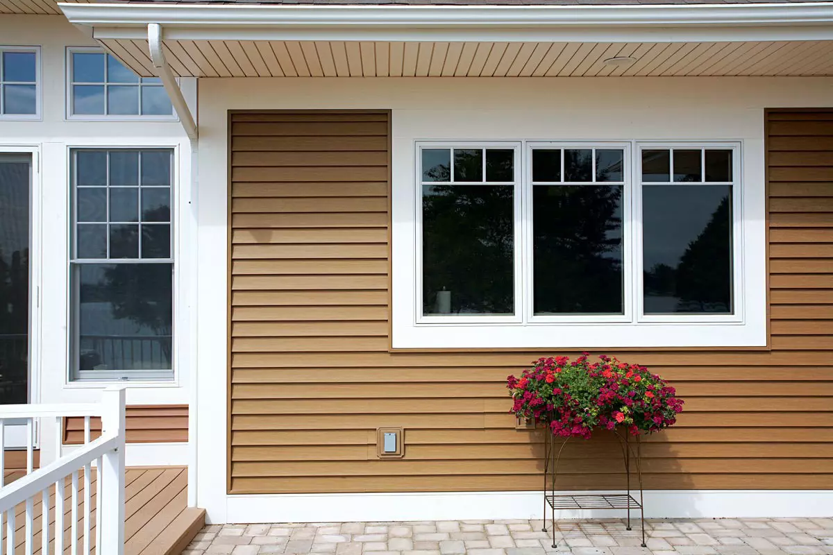 Yellow vinyl siding on home exterior 