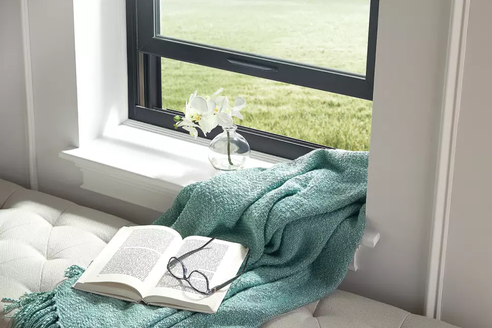 A reading nook that has an open window