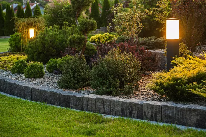 Landscape lighting along the front entryway of a home to increase curb appeal and
make the home stand out in the morning and at night.