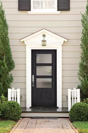Textured Steel Entry Door, in a 3/4 Lite, 2 Panels door style and Modern Wide Simulated Divided Lites with Rain glass, prefinished in Obsidian, and with a Baldwin Del Mar Handleset in Satin Nickel.