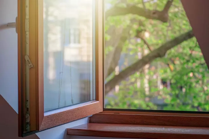 A wooden window open to the inside of a home to circulate fresh air and equalize
humidity levels.