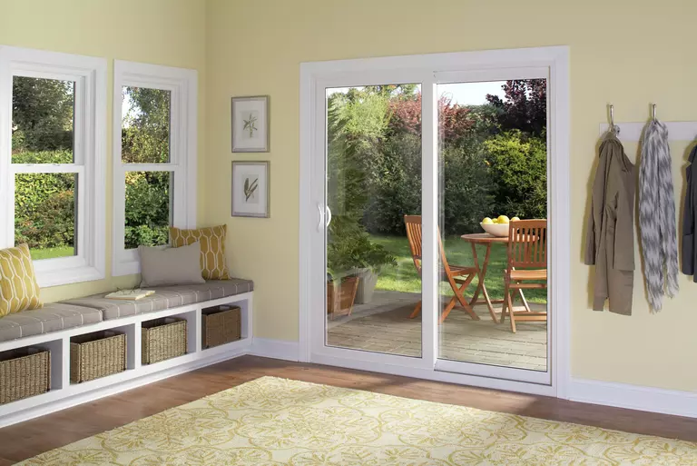 Contemporary sliding patio door leading to outside living space.