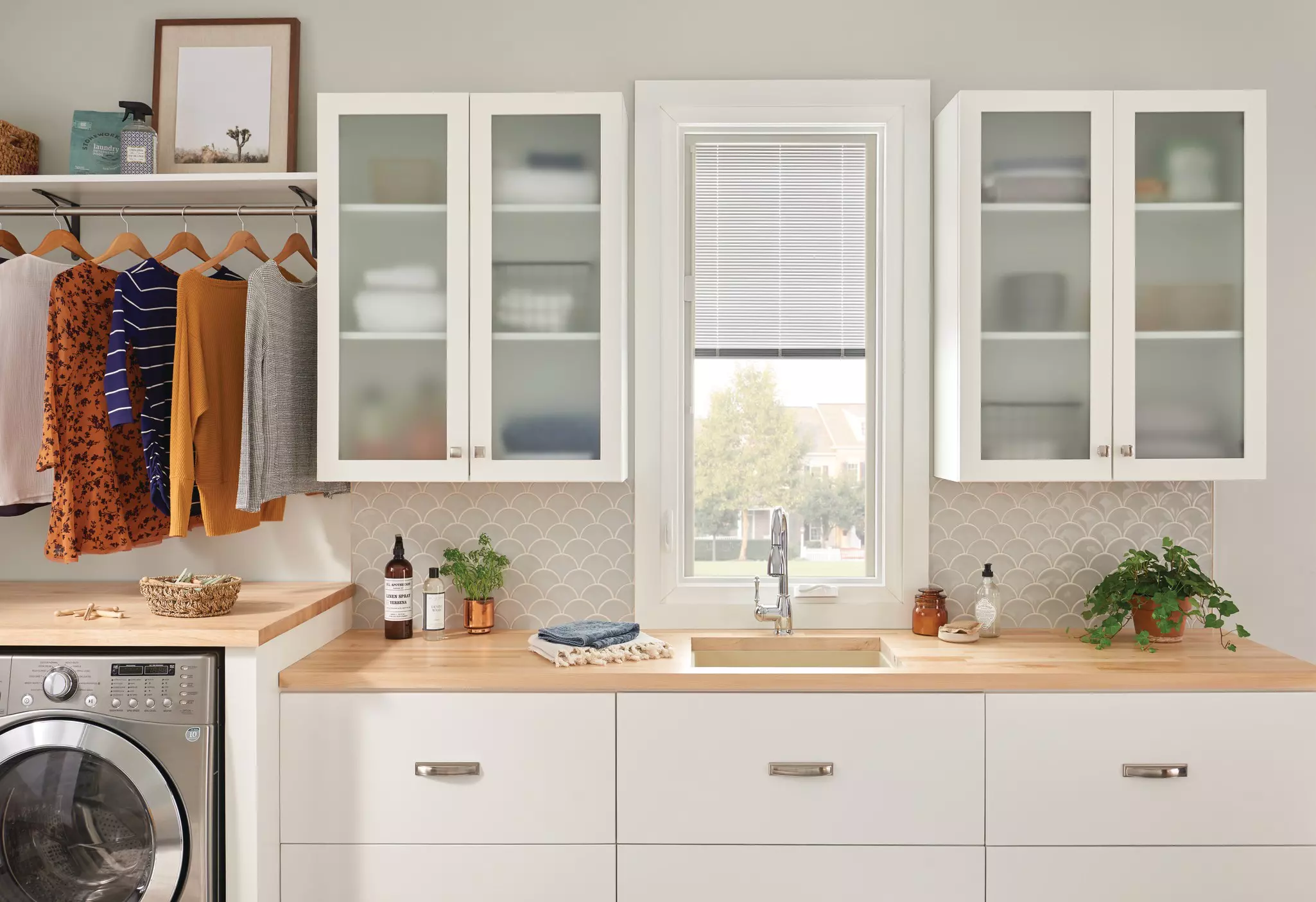 Laundry room with double-hung window letting in natural light and airflow.