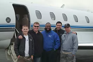 Greg with 4 veterans outside of the VAC jet